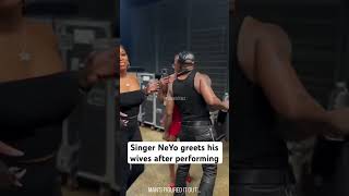 Singer NeYo greets his wives after performing