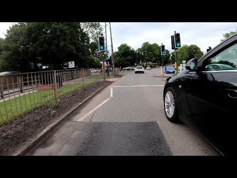 MGIF Close Pass of a Cyclist at a Traffic Island