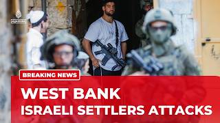 Dozens of settlers escorted by Israeli forces have attacked Palestinians north of Ramallah