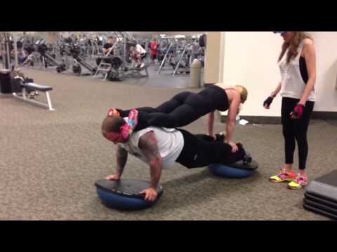 Ultimate three person plank on two bosu balls
