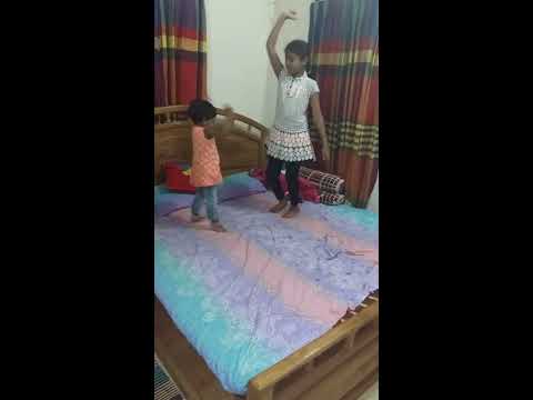 Safwana dancing on the bed with Maisha