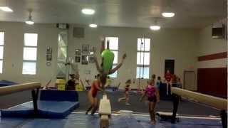 Dive rolls on beam- Iowa Gym-Nest