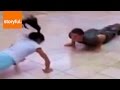Little Girl Competes with Marine At Push Up ...