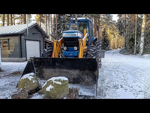 Removing rocks and dirt with Ford TW10 Tractor before house build