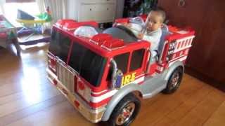 7 month old baby boy Christian driving his new fire truck rescue fighter