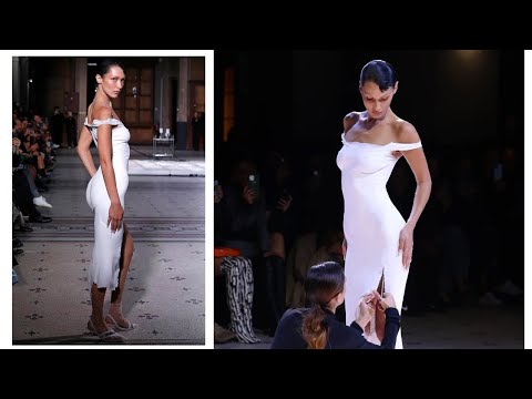 Dress sprayed onto Bella Hadid on Coperni runway at Paris Fashion Week