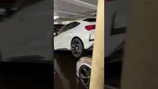 Damaged new cars in a flooded showroom in Germany
