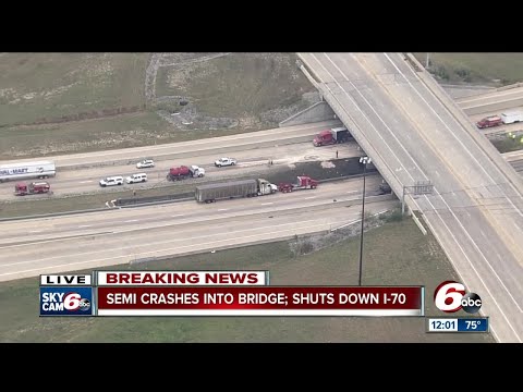 Semi crashes into bridge, oil spilled on I-70