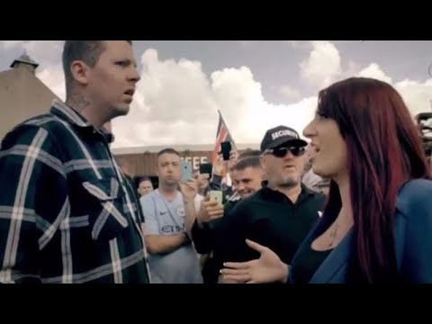Professor Green confronts Britain First leader as mob chants racist abuse