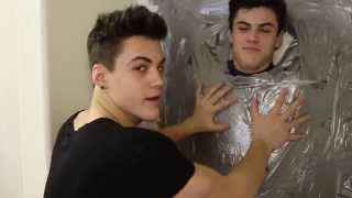 TAPED TO THE WALL PRANK! // Dolan Twins