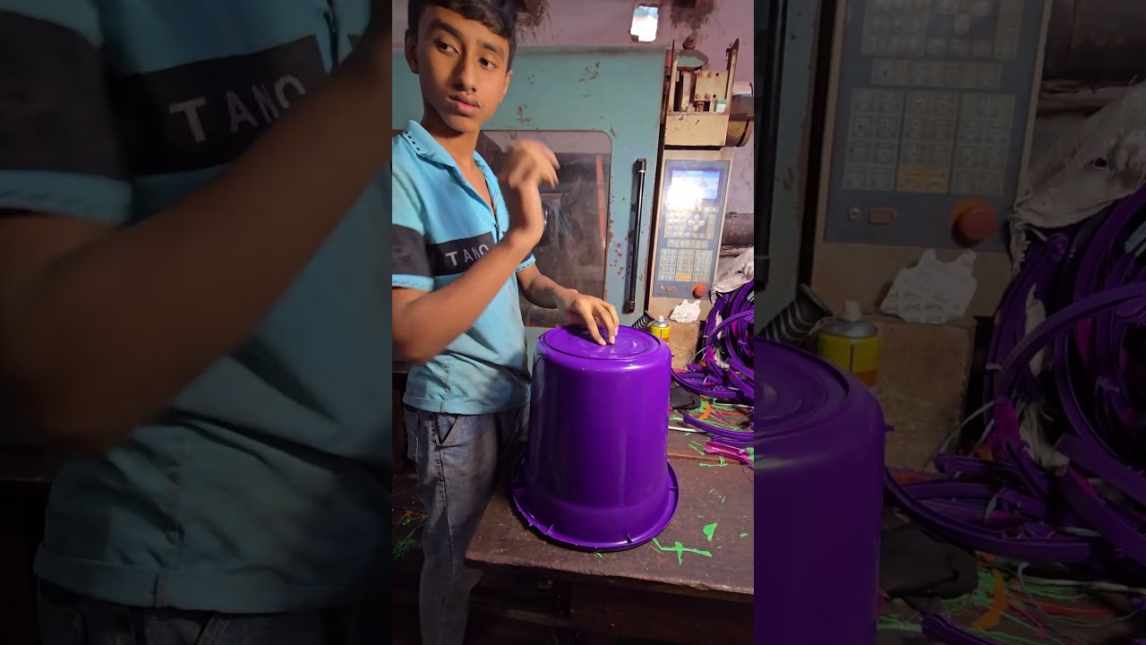 “A young boy skillfully turning discarded plastic into a new bucket.”🪣