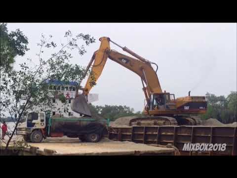 CAT 375 Excavator Unloading Gravel From A Barge