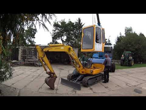 #694. "Montaż okna do kabiny i kabiny do koparki".