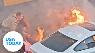 Good Samaritan, cop rescue unconscious driver before car catches fire | USA TODAY