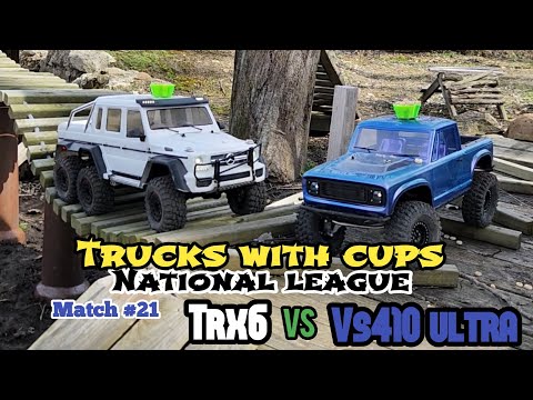 VS4-10 Ultra vs TRX6 prize wheel match of trucks with cups Match 21 at "World Class" Crawler County