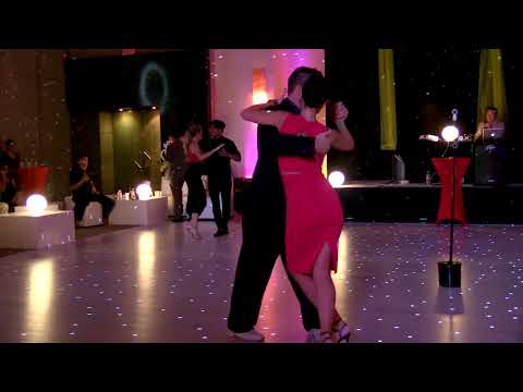  Daniela Roig,    Hernan Alvarez Prieto,    Sebastian Arce,    Carlos Espinoza,    Noelia Hurtado Pitruzzella,    Luciano Brigante,    and  Alejandra Orozco  are  dancing  to  the  tango  "  Guapeando  "  by  Aníbal Troilo  at  Tango Maya Festival  in  2017