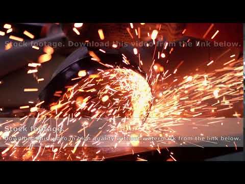Cutting metal with disc grinder with bright sparks