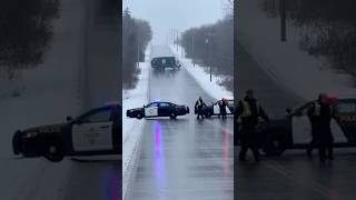 Garbage truck slides down icy hill