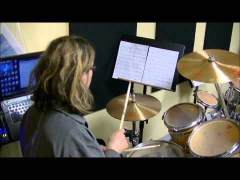 Birds eye view,  a drummer writing a drum cover and performing it.