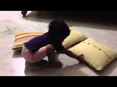 Mayukha playing with pillow