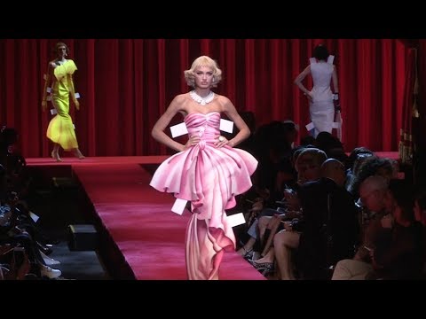 Models and designer Jeremy Scott on the runway of the Moschino Fashion Show in Milan