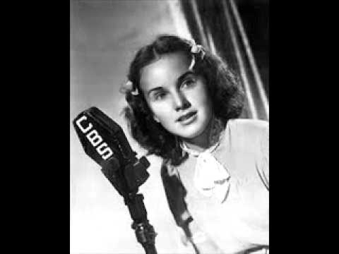Deanna Durbin Sings "Beneath The Lights Of Home"