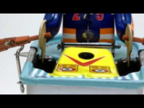 Rowboat wind-up tin toy  with rowing athlete