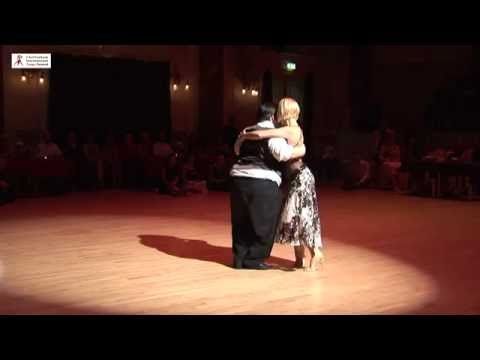  Alejandra Mantinan  and  Aoniken Quiroga  are  dancing  to  "  La Mulateada  "  at  Cheltenham International Tango Festival  in  2016