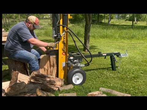 Splitting with a 25 ton CountyLine log splitter and stacking firewood