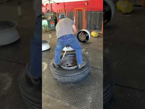 Mounting 11R22.5 semi tire.