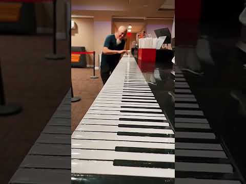 fastest piano player playing the longest piano in the world????