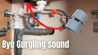 A plumber shows how to solve a gurgling noise from a sink drain