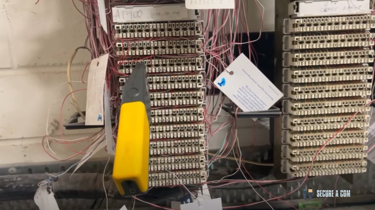 SECURE A COM technician diagnosing multiple faults at an apartment complex — bridge tap removal, short-circuited cable, and FTTB MDF jumpering