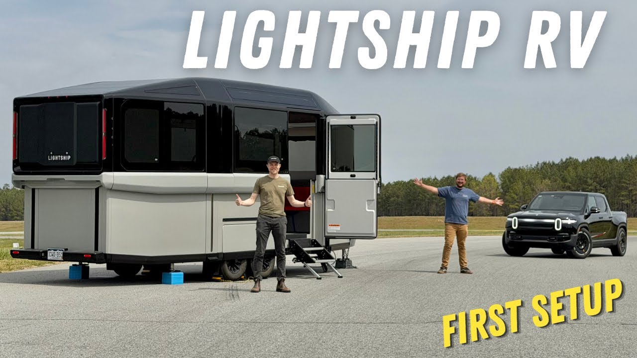 The Lightship aero-electric travel trailer raised into camp mode at the Out of Spec Reviews track in North Carolina, with co-founder Ben standing beside it