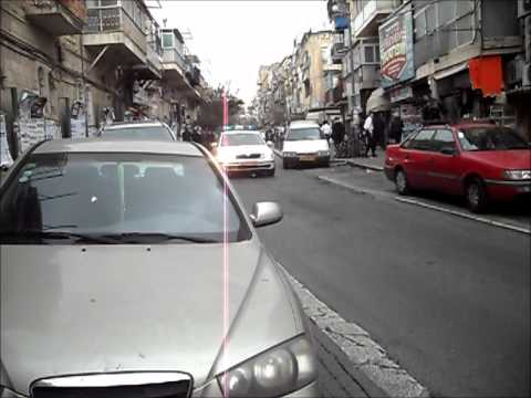 Fiveish returns to Meah Shearim with an escort one week after getting attacked there.