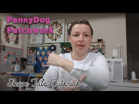 Part of a video titled How to make Sleeve Tabs - or Swiss Tabs - for a shirt or top - YouTube