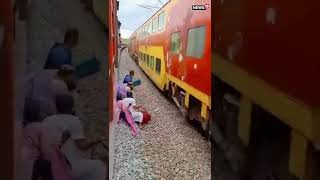 Railway Track Ruckus: Passengers Cross Seconds Before Train&#39;s Arrival | #Shorts | #ViralVideo
