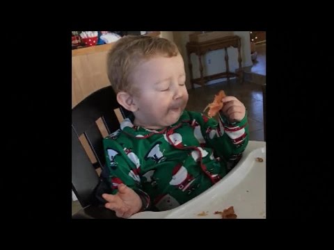 Baby's reaction to his first piece of bacon