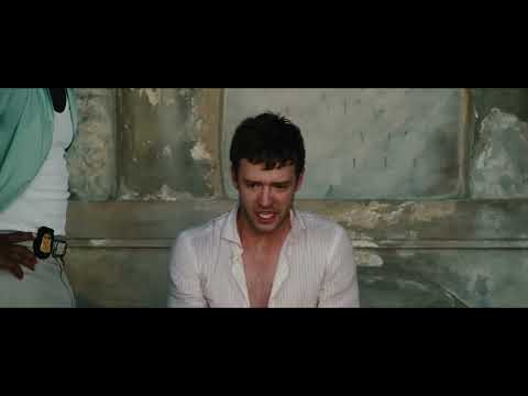Runner Runner official trailer frame — neon-lit Costa Rica night as synth pulses begin
