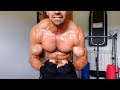 bodybuilder posing with his big pecs