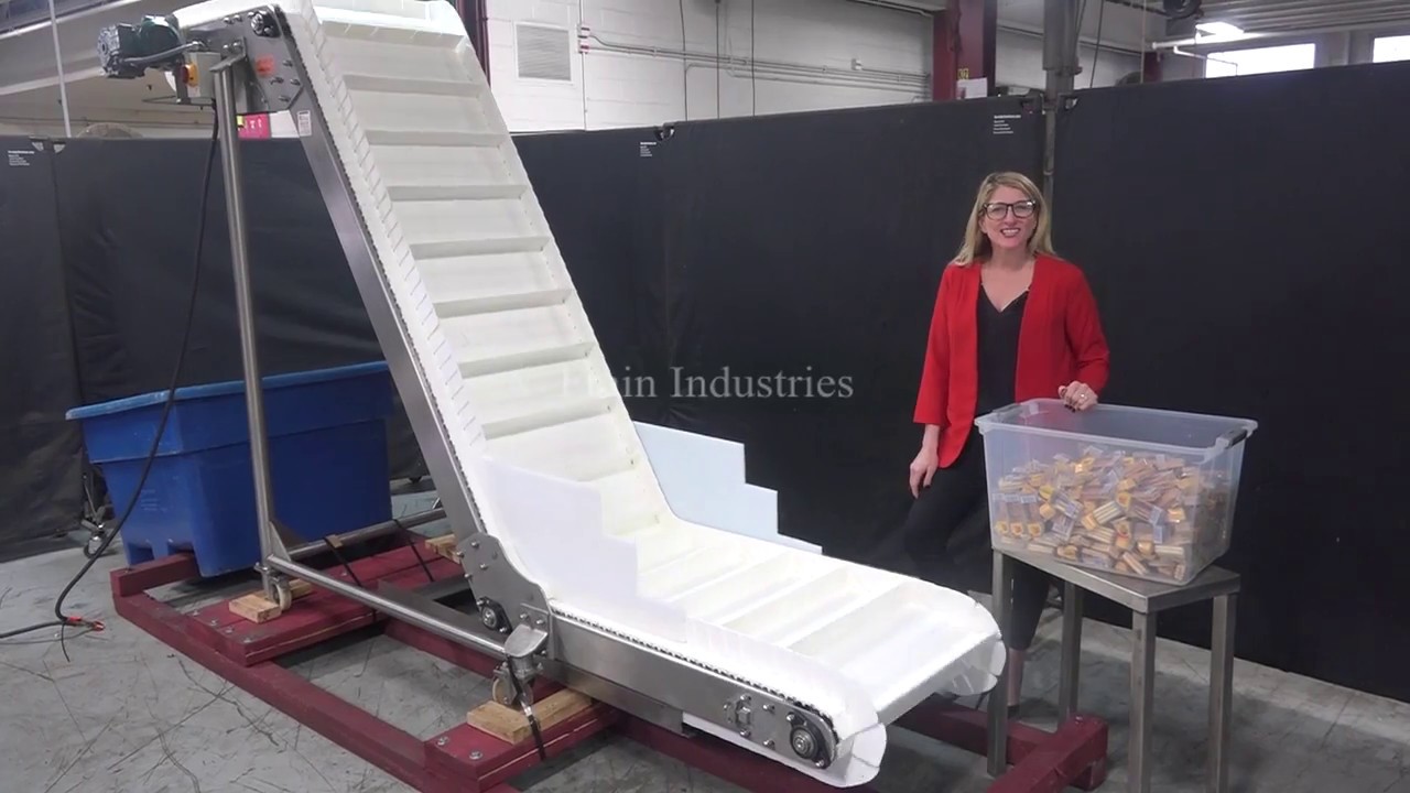 Stainless steel, inclined cleated conveyor