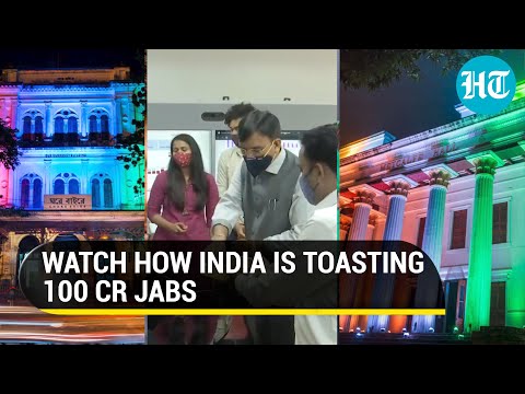 India lights up to celebrate 100 crore Covid jabs, Mansukh Mandaviya distributes sweets
