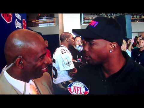 Deon Sanders gives Ocho Cinco a child please at superbowl XLIV media day
