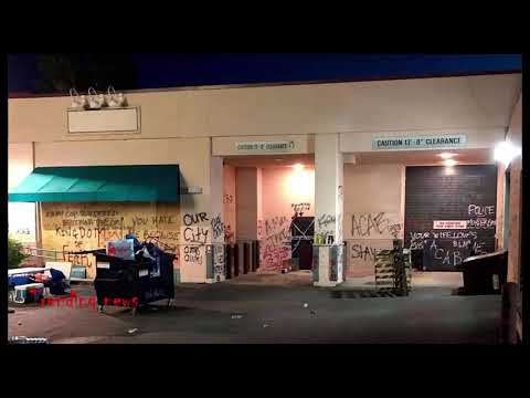 Portland man allegedly set dumpster on fire alongside police building with 19 people inside