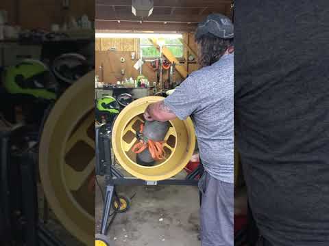 Tumbling old scuba tank .  with whatever works