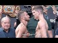 LUKE CAMPBELL LOOKS DOWN ON VASYL LOMACHENKO DURING WEIGH IN FACE OFF IN LONDON