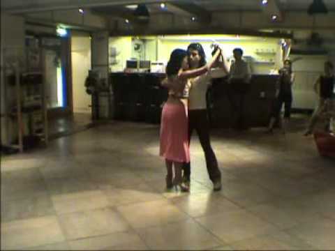  Javier Rodriguez  and  Geraldine Rojas  are  dancing  to  the  milonga  "  Cacareando  "