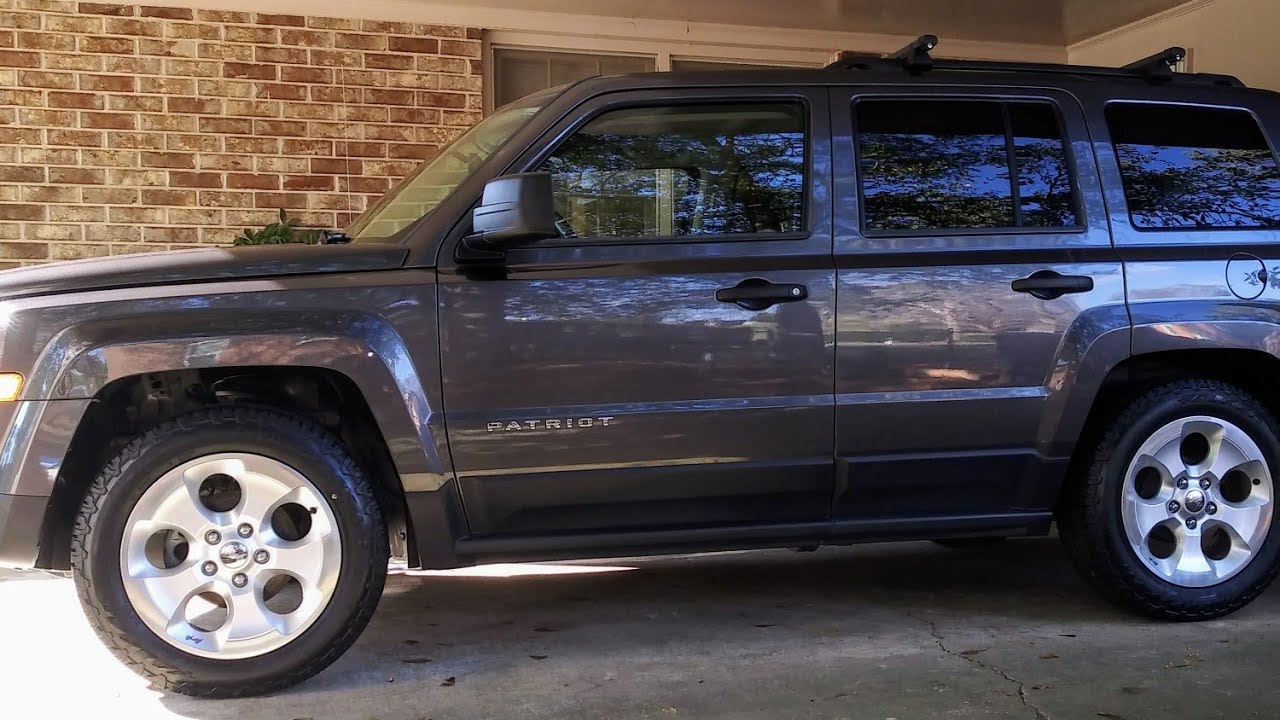 Test fitting Wrangler wheels on a Patriot.