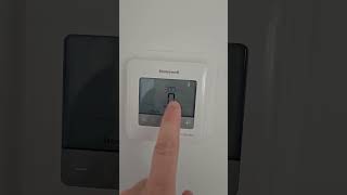 How to turn on auto setting on Honeywell Pro Series thermostat