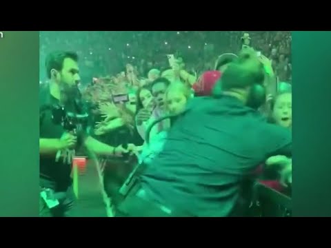 Billie Eilish aggressively pulled by fan in barricade during Miami concert, video shows